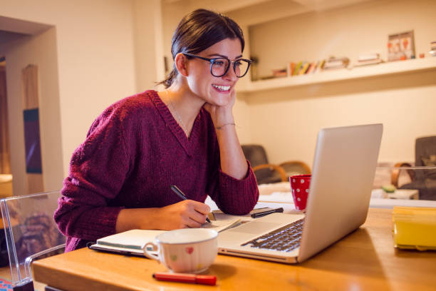 beautiful smiling woman using her computer